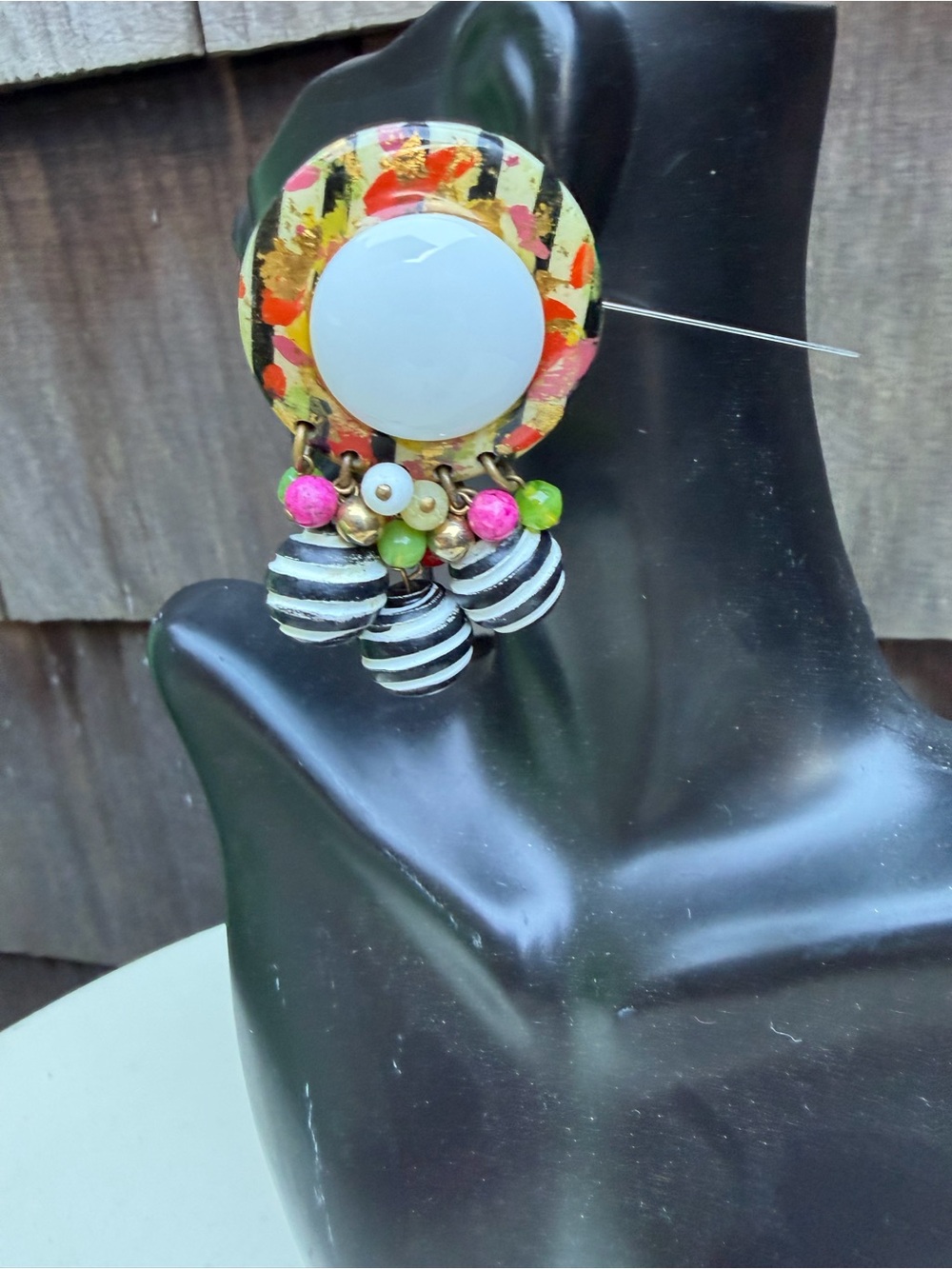 Vintage New Wave dangle earrings 2.5”
clip on resin round with stripe beads